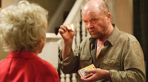 Phil about to set The Queen Vic on fire in front of Peggy (2010).