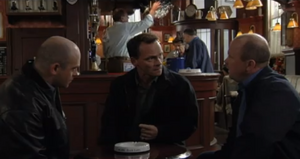 Phil listens as Billy explains to him and Grant how their criminal heists have put them at loggerheads with a notorious loan shark named Kim Brooks.