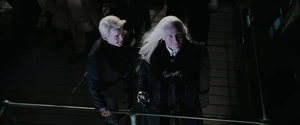 Lucius and Draco at the 1994 Quidditch World Cup taunting Harry and the Weasley family.