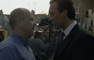 Phil and Steve confront each other again outside the square (2002).