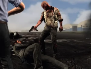 Max holding Victor at gunpoint on the airport runway.