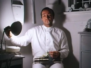 Tony finds Albert, attempting to build his last bomb and kill himself.