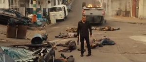 Zizi examining the deaths of Reyes' gang and Hobbs' team in a shootout where Dom and Brian escaped from him again.