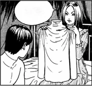 Fortune Teller giving Tomio a turtleneck sweater.