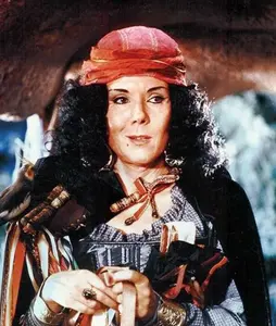 The Queen disguised as an evil saleswoman.