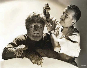 A behind the scenes pic of Lon Chaney Jr. having the makeup applied by legendary makeup-artist Jack Pierce.