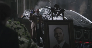 Colson crashes Mitchell's funeral.