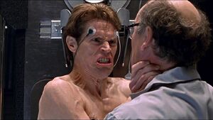 The Goblin strangling Norman's lab partner Dr. Mendell Stromm.