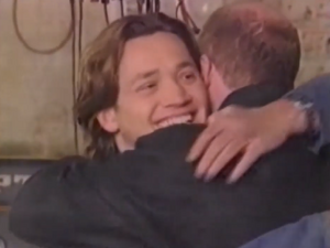 Phil embraces Ricky after agreeing to be his best-man for the latter's wedding to Bianca (1997).