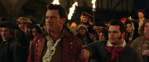 Gaston's furious stare being showed as he showed contempt on Belle's defiance and her defense for the Beast while LeFou attempts to reason out to Gaston.