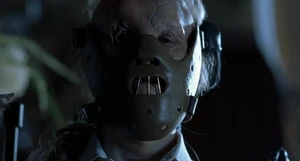 Verger wearing Hannibal's mask.