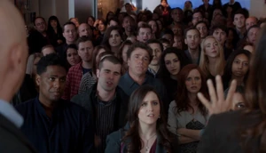 Appearing in a crowd.