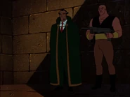 Ubu holding Bruce and Talia at gunpoint