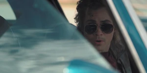 Billy reprimanding Max as he drops her off at the arcade.