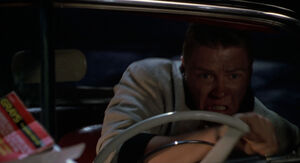 Biff drives his car, like the madman that he is.