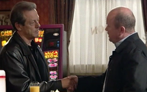 Phil Mitchell shake hands with Dirty Den as he agrees to do an armed robbery with him.