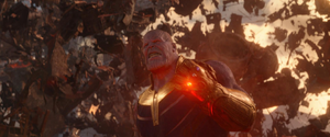 Thanos angrily battles Iron Man's team.