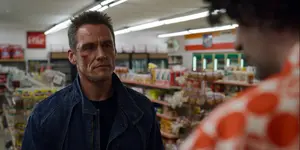 Grigori inside 7-Eleven where he hears the cashier explain a car got stolen at the gas station.