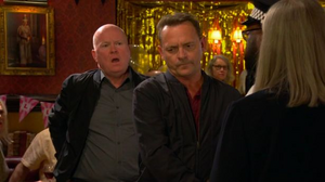 Phil watches on guiltily as Billy gets arrested by Keeble for the murder of her father - earlier on Phil had been forced by Keeble to grass up Billy to the police for the crime in exchange for not going back to prison.