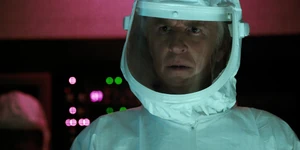 Brenner horrified when bloody pieces of clothing come through the portal, realizing Shepard had been killed.