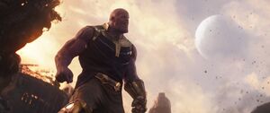 Thanos preparing to use Titan's moon as a weapon.