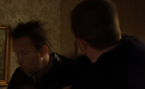 Phil punching Eric when the latter attempts to beat him up.