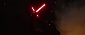 Kylo actives his lightsaber