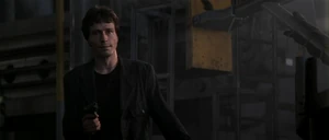 Korda confronting Scott at an abandoned shipyard after escaping from prison.