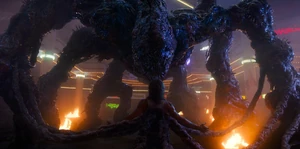 Billy in the Mind Flayer's grasp as the monster slowly crushes him.