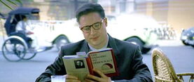 Alden Pyle reading York Harding's book
