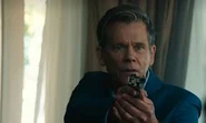 Grant with his gun pointed at Foley
