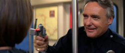 Payne hijacks a subway train with Annie as his hostage and Payne's second evil grin.