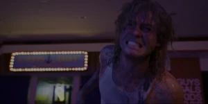 Billy cringing in pain as the Party fights the Mind Flayer with fireworks.
