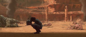 Boba cradles his father's helmet, swearing vengeance against the Jedi who killed Jango.