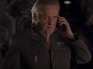 Luchkov receiving an unwanted call from Agent Coulson.