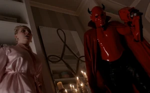 The Red Devil shooting Roger with a nail gun.