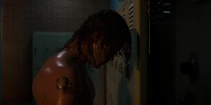 Billy changing into his clothes in the men's lifeguard locker room.