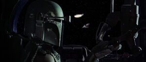 Boba Fett perusing the Millennium Falcon.