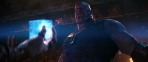 Thanos removes his armor before taking the Tesseract from Loki.