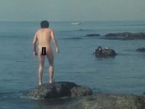Kemp emerges naked from the sea after reverting to his 16 year old self.