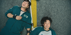 Sang-woo and Gi-hun after their team won the Tug-of-War game.