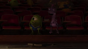 Randall observe Sulley throwing Mike's books on the floor.