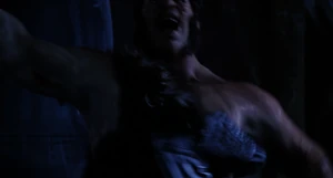 Mr. Hyde lashing out with one of his huge hands slamming Van Helsing into a wall.