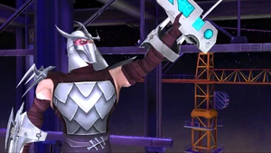 Shredder is holding his Super Mutagen Weapon.