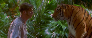 Wilkins being confronted by an angry Shere Khan for shooting Baloo.