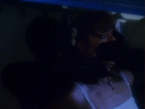 Alex slashing Kelly’s throat.