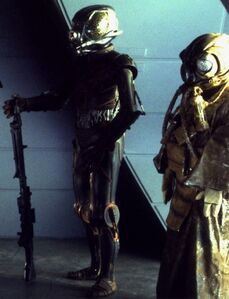 4-LOM with its bounty hunting partner, Zuckuss, aboard Darth Vader's ship.