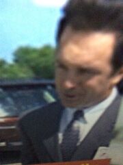 Mark McKinney about to hit joe Scheffer in the parking lot .jpg
