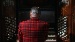 De Wynter playing the organ.