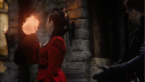 Snow White conjures a fireball with magic.